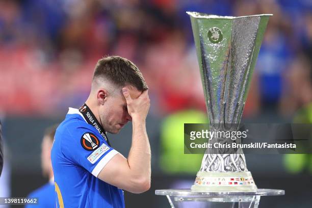 Aaron Ramsey of Rangers reacts as he walks past the trophyfollowing the UEFA Europa League final match between Eintracht Frankfurt and Rangers FC at...