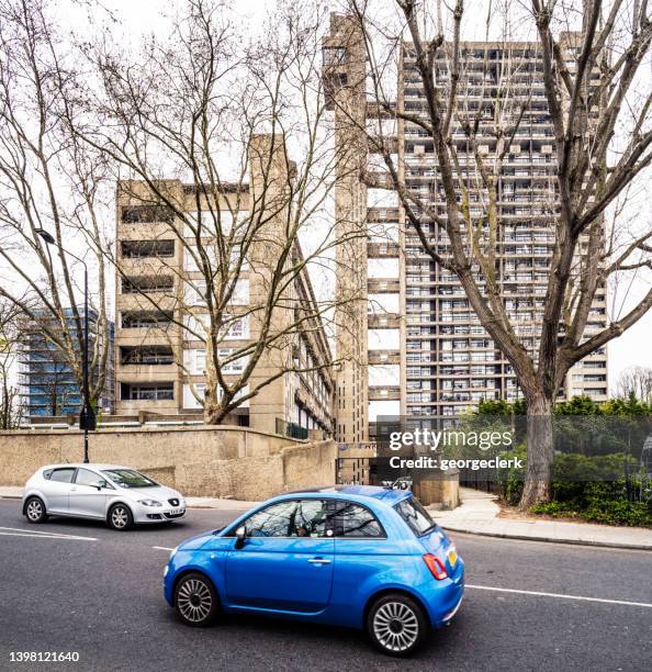 driving past the trellick tower - trellick tower stock pictures, royalty-free photos & images