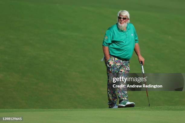 John Daly of the United States waits to putt on the tenth green during the first round of the 2022 PGA Championship at Southern Hills Country Club on...