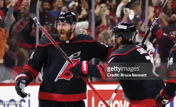 Ian Cole of the Carolina Hurricanes scores at 3:12 of overtime against Igor Shesterkin of the New York Rangers in Game One of the Second Round of the...