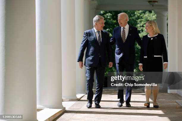 President Joe Biden walks with Finland's President Sauli Niinisto and Sweden's Prime Minister Magdalena Andersson along the Rose Garden colonnade...