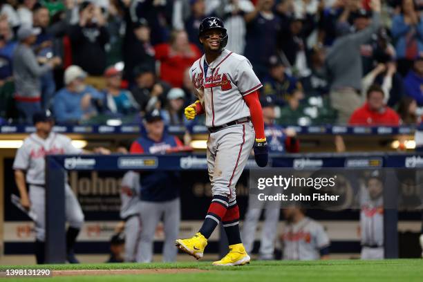 Ronald Acuna Jr. #13 of the Atlanta Braves reacts and walks toward home plate after a home run by Marcell Ozuna against the Milwaukee Brewers at...