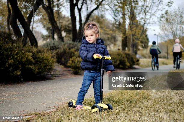 girl with scooter waiting for someone - girl waiting stock pictures, royalty-free photos & images