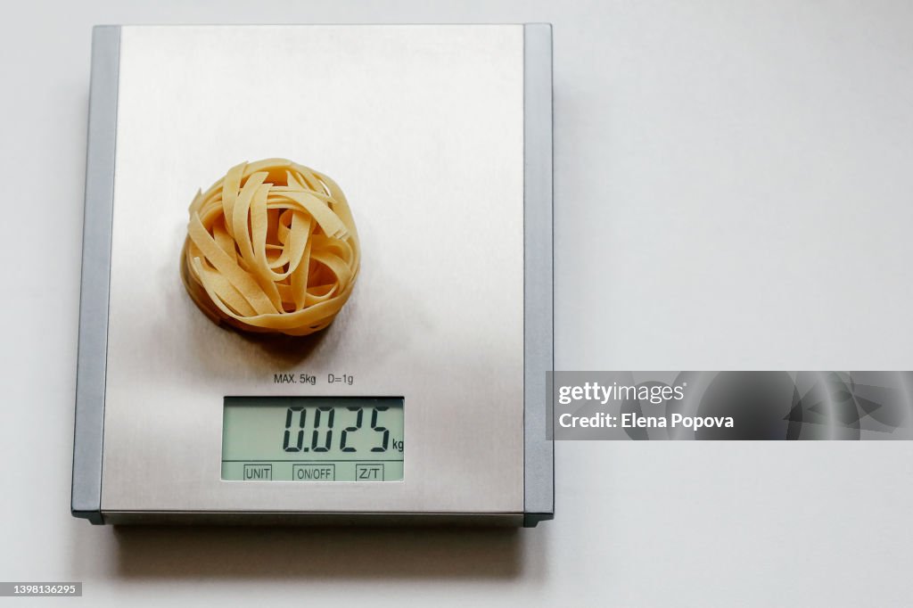 Tagliatelle Pasta At The Kitchen Scale