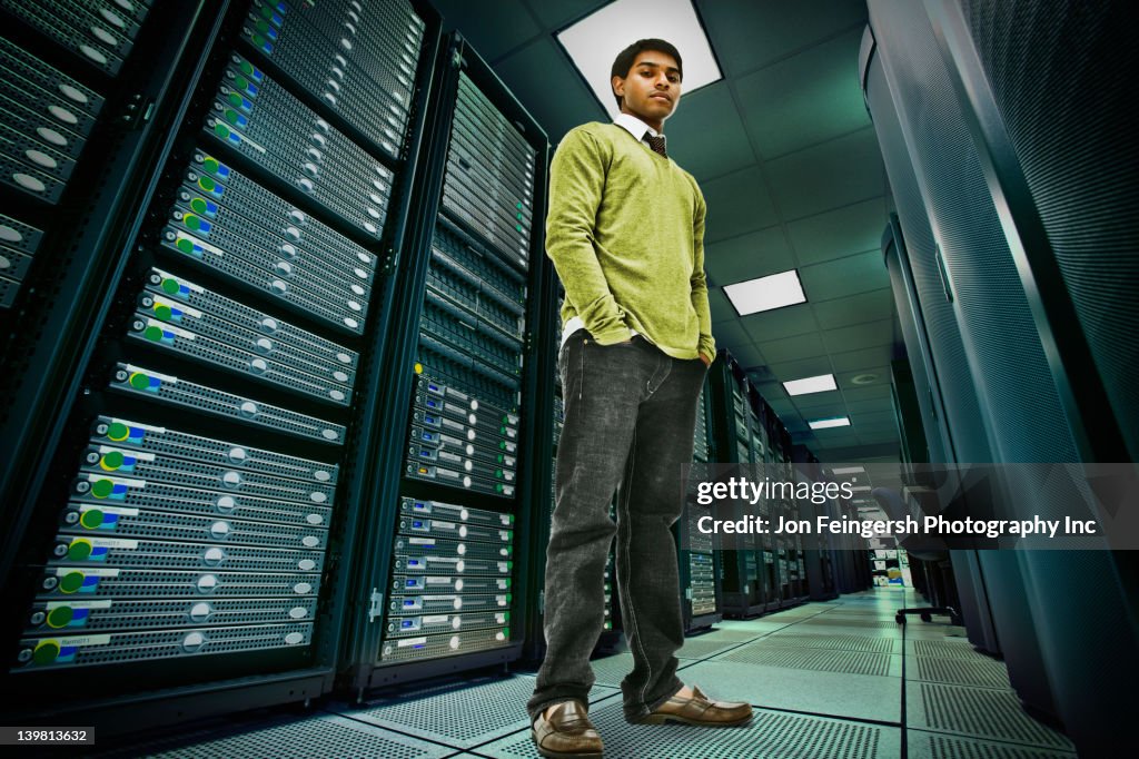 Businessman standing in server room