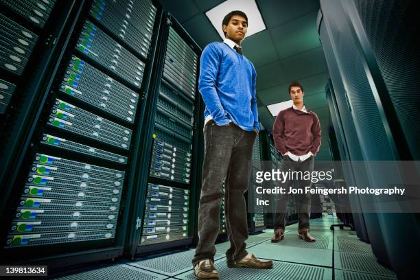 businessmen standing together in server room - good technology inc stock pictures, royalty-free photos & images