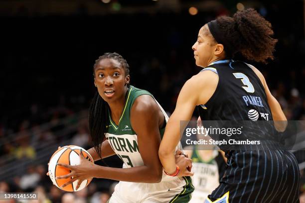 Ezi Magbegor of the Seattle Storm looks to pass against Candace Parker of the Chicago Sky during the second half at Climate Pledge Arena on May 18,...