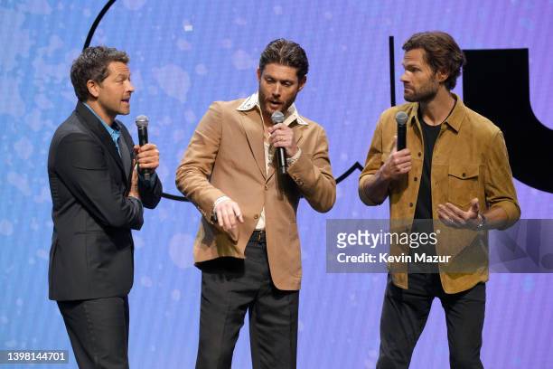 Misha Collins, Jensen Ackles, and Jared Padalecki speak onstage during The CW Network's 2022 Upfront Presentation at New York City Center on May 19,...