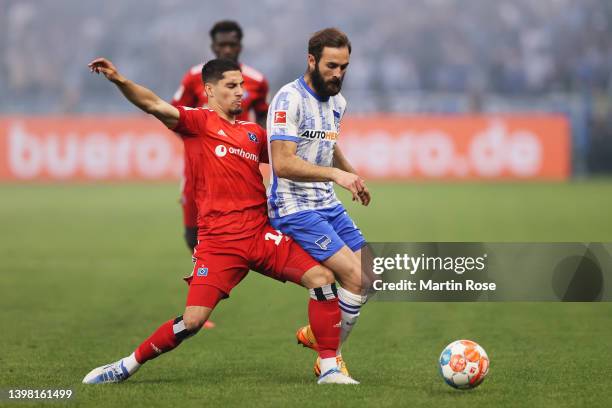 Ludovit Reis of Hamburger SV battles for possession with Lucas Tousart of Hertha BSC during the Bundesliga Playoffs Leg One match between Hertha BSC...