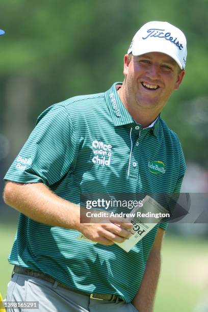 Tom Hoge of the United States smiles on the 17th green during the first round of the 2022 PGA Championship at Southern Hills Country Club on May 19,...