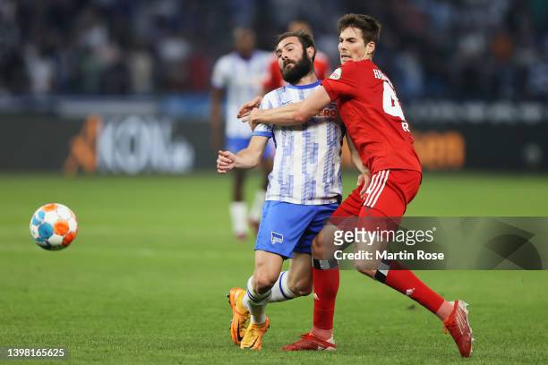 Lucas Tousart of Hertha BSC is challenged by Maximilian Rohr of Hamburger SV during the Bundesliga Playoffs Leg One match between Hertha BSC and...