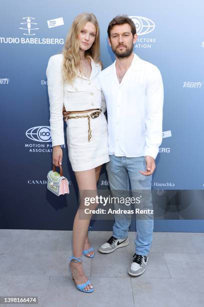 Alex Pettyfer and Toni Garrn attend a cocktail reception celebrating more than a century of filmmaking in Europe commemorating 110 years of Studio...