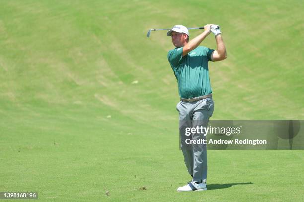 Tom Hoge of the United States plays his second shot on the 18th green during the first round of the 2022 PGA Championship at Southern Hills Country...