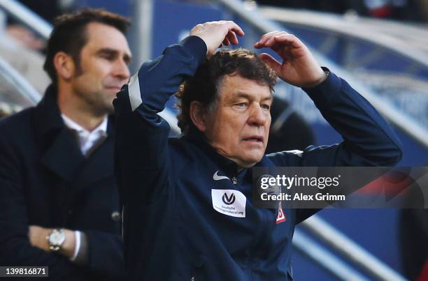 Head coach Otto Rehhagel , assistant coach Rene Tretschok and manager Michael Preetz of Berlin react during the Bundesliga match between FC Augsburg...