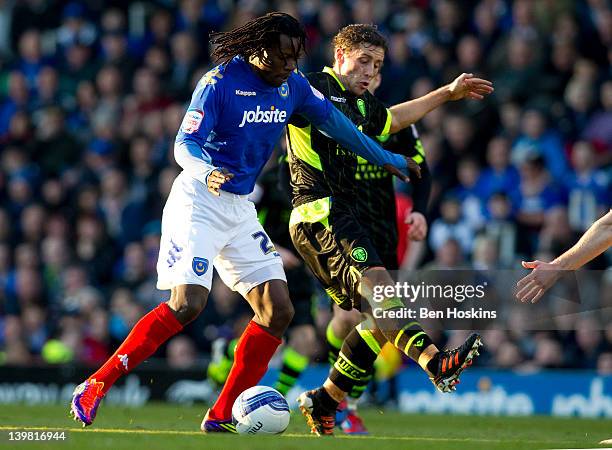 Benjani of Portsmouth holds off the challenge of Danny Pugh of Leeds during the npower Championship match between Portsmouth and Leeds United at...