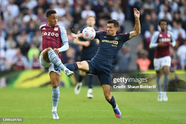 Jacob Ramsey of Aston Villa is tackled by Jack Cork of Burnley during the Premier League match between Aston Villa and Burnley at Villa Park on May...