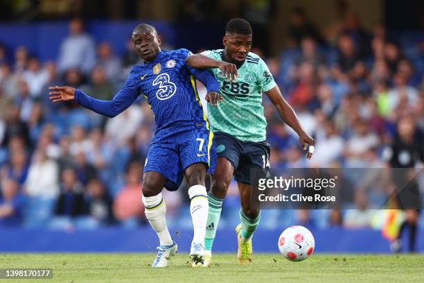 Ngolo Kante of Chelsea is challenged by Kelechi Iheanacho of Leicester City during the Premier League match between Chelsea and Leicester City at...