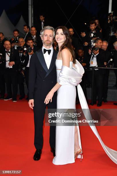 Adam Shulman and Anne Hathaway depart from the screening of "Armageddon Time" during the 75th annual Cannes film festival at Palais des Festivals on...