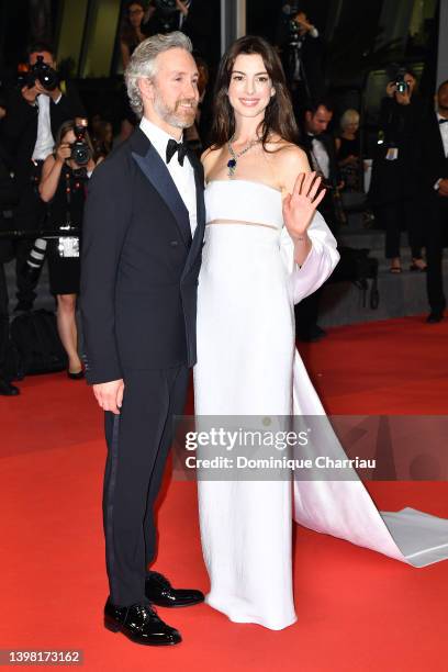 Adam Shulman and Anne Hathaway depart from the screening of "Armageddon Time" during the 75th annual Cannes film festival at Palais des Festivals on...