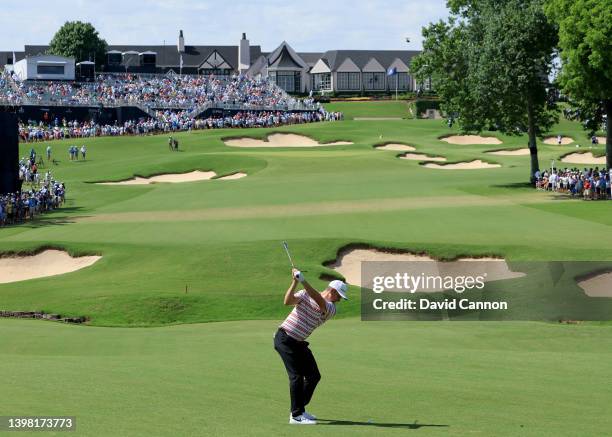 Justin Rose of England plays his second shot on the 18th hole during the first round of the 2022 PGA Championship at Southern Hills Country Club on...