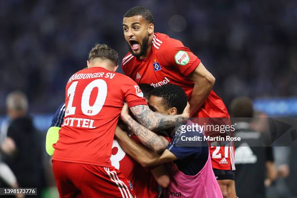 Ludovit Reis of Hamburger SV celebrates with team mates after scoring their sides first goal during the Bundesliga Playoffs Leg One match between...