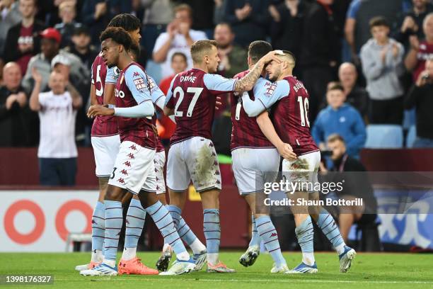Emiliano Buendia of Aston Villa celebrates with team mates after scoring their sides first goal during the Premier League match between Aston Villa...