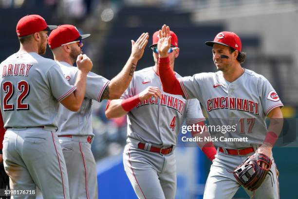 Kyle Farmer, Brandon Drury, Mike Moustakas and Matt Reynolds of the Cincinnati Reds celebrates the team's 4-2 win over the Cleveland Guardians at...