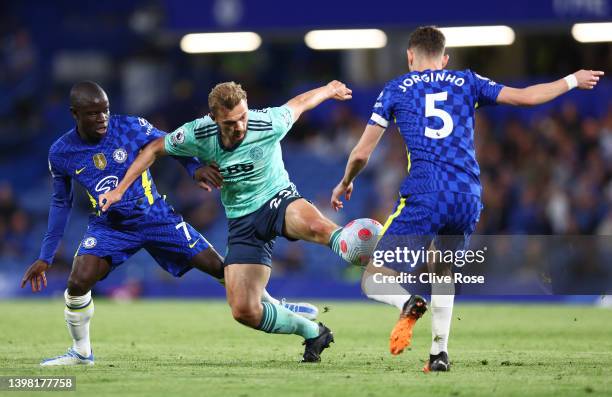 Kiernan Dewsbury-Hall of Leicester City is challenged by Ngolo Kante and Jorginho of Chelsea during the Premier League match between Chelsea and...