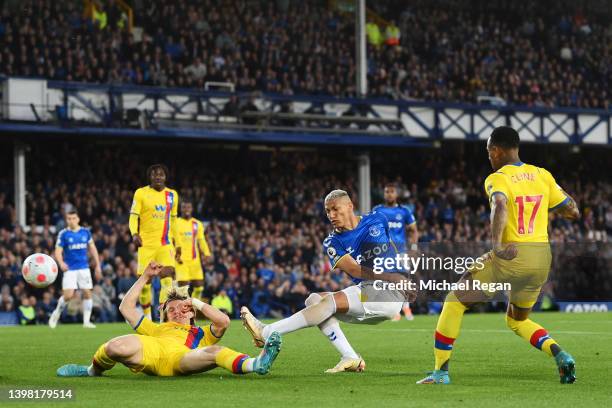 Richarlison of Everton scores their sides second goal during the Premier League match between Everton and Crystal Palace at Goodison Park on May 19,...