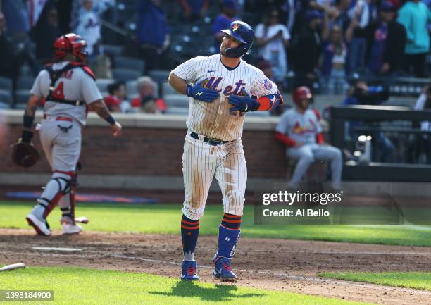 Pete Alonso of the New York Mets celebrates after hitting a walk off two run home run to win the game in ten innings against the St. Louis Cardinals...