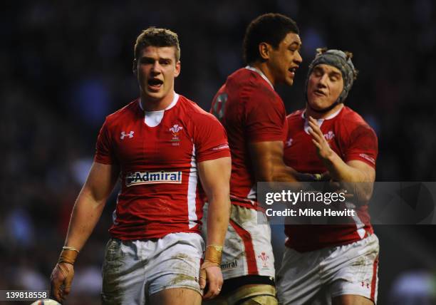 Scott Williams of Wales celebrates alongside Toby Faletau and Jonathan Davies after scoring his try during the RBS 6 Nations match between England...