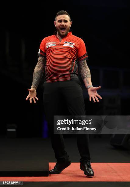 Joe Cullen of England celebrates defeating Jonny Clayton of Wales in the final during the Cazoo Premier League Darts at The O2 Arena on May 19, 2022...
