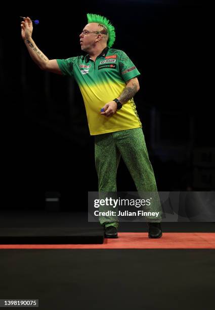 Peter Wright of Scotland throws in the semi final against Joe Cullen of England during the Cazoo Premier League Darts at The O2 Arena on May 19, 2022...