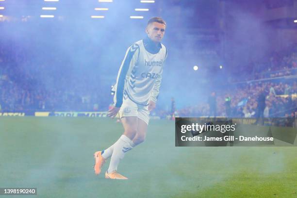 Jonjoe Kenny of Everton throws a blue flare during the Premier League match between Everton and Crystal Palace at Goodison Park on May 19, 2022 in...