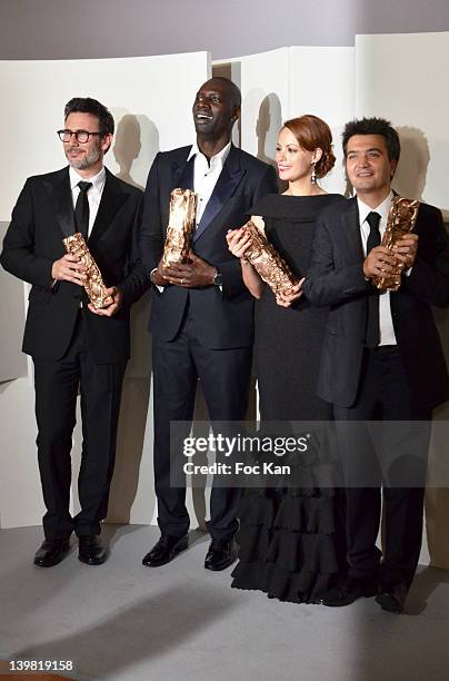 Michel Hazanavicius, Omar Sy, Berenice Bejo and Thomas Langmann pose after receiving Cesar Awards during the 37th Cesar Film Awards at Theatre du...