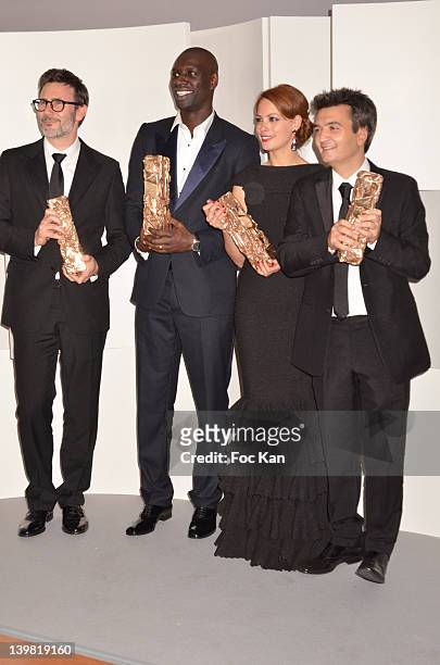 Michel Hazanavicius, Omar Sy, Berenice Bejo and Thomas Langmann pose after receiving Cesar Awards during the 37th Cesar Film Awards at Theatre du...