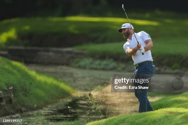 Dustin Johnson of the United States plays a shot on the 17th hole during the first round of the 2022 PGA Championship at Southern Hills Country Club...