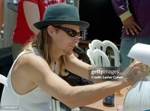 American singer, songwriter and rapper Kid Rock, signs autographs during the KROQ Weenie Roast on June 19, 1999 at the Irvine Meadows Amphitheatre in...