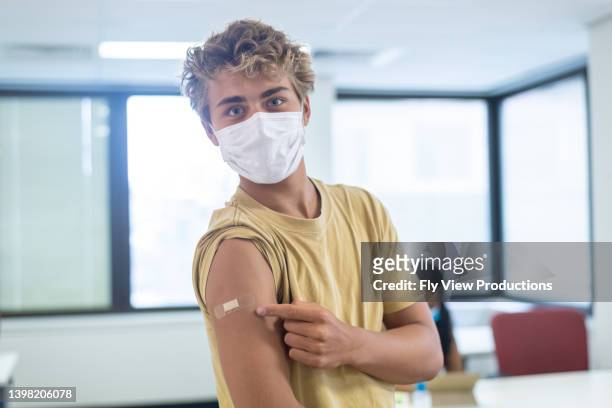 vaccinated teenage boy - aussie flu stock pictures, royalty-free photos & images
