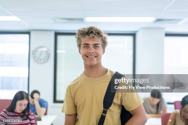 happy male high school student - high school student stock pictures, royalty-free photos & images