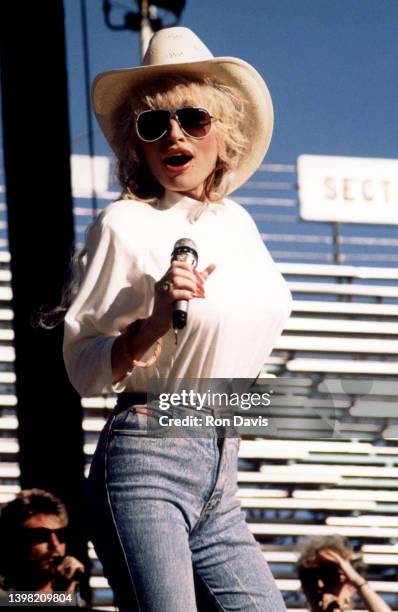 American singer-songwriter, actress, and businesswoman Dolly Parton, speaks on stage during fan fair circa 1995 in Nashville, Tennessee.