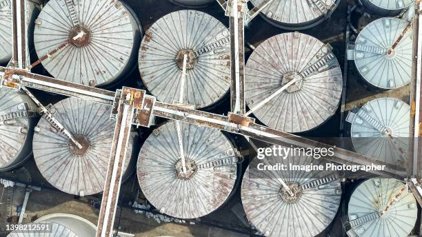 aerial top view, paddy silo steel fermentation tanks for rice, grain plant. about for agricultural industry. - rice production stockfoto's en -beelden