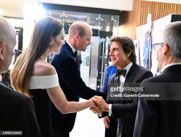 Catherine, Duchess of Cambridge and Prince William, Duke of Cambridge greet Tom Cruise at the Royal Film Performance and UK Premiere of "Top Gun:...
