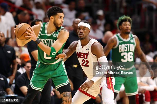 Jayson Tatum of the Boston Celtics handles the ball against Jimmy Butler of the Miami Heat during the second quarter in Game Two of the 2022 NBA...
