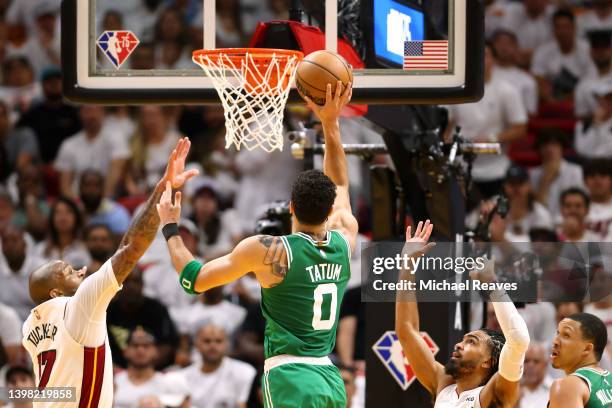 Jayson Tatum of the Boston Celtics shoots the ball against P.J. Tucker and Gabe Vincent of the Miami Heat during the second quarter in Game Two of...