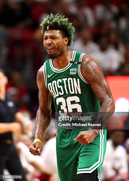Marcus Smart of the Boston Celtics reacts after a three point basket during the fourth quarter against the Miami Heat in Game Two of the 2022 NBA...