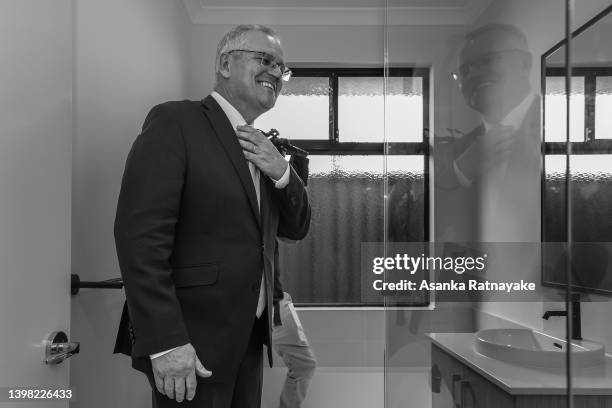 Prime Minister Scott Morrison visits a residential property under construction at a housing estate in Jindalee, which is in the electorate of Pearce,...