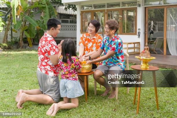 songran thailand new years festival and water festival, thai family day. - songkran stock pictures, royalty-free photos & images
