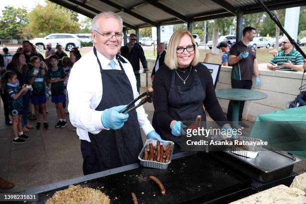 Prime Minister Scott Morrison cooks a sausage sizzle on a BBQ during a visit to Wanneroo Rugby Union Club, which is in the electorate of Pearce, on...
