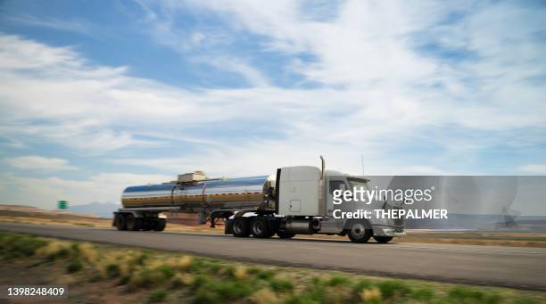 white and silver fuel semi-truck speeding - panning motion blur - gas truck stock pictures, royalty-free photos & images